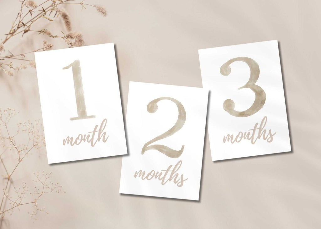 Beige baby milestone cards for 1, 2, and 3 months in printable set